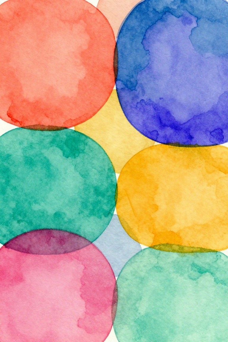 Overlapping translucent watercolor circles in vibrant red, blue, yellow, and green hues