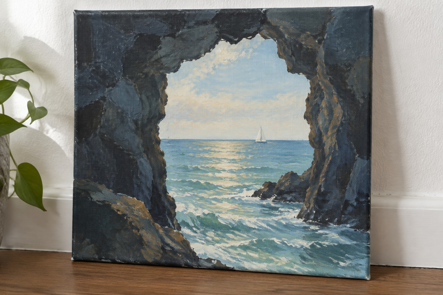 Realistic oil painting of sunset seascape with sailboat viewed through dark rocky cave opening