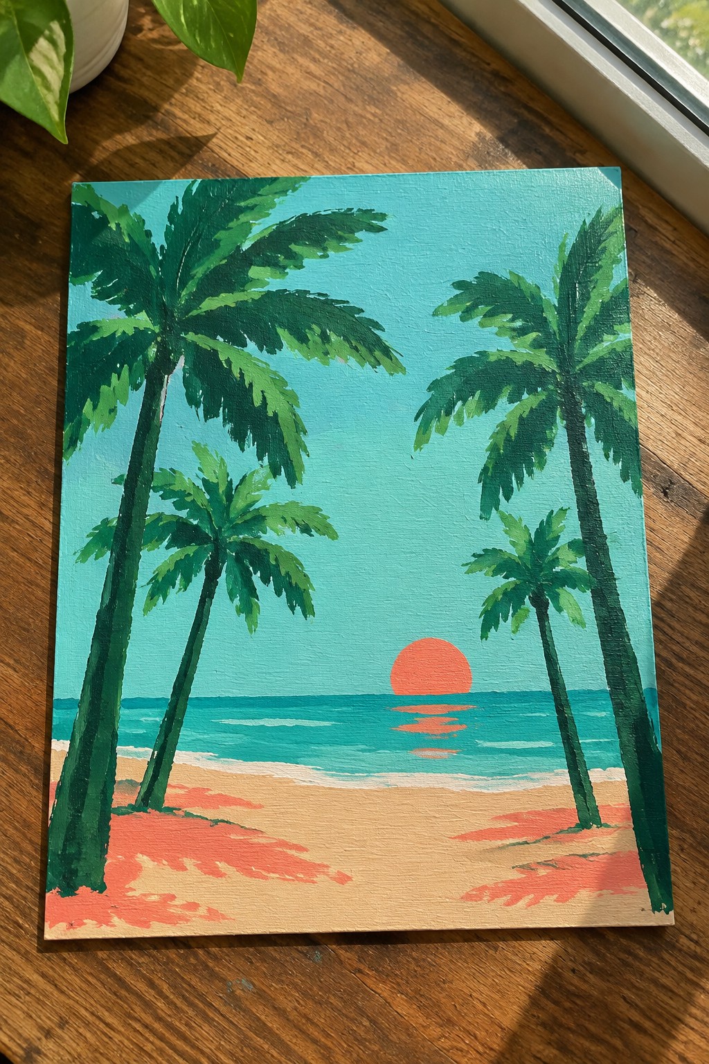 Colorful painting of palm trees on sandy beach with turquoise ocean and setting sun