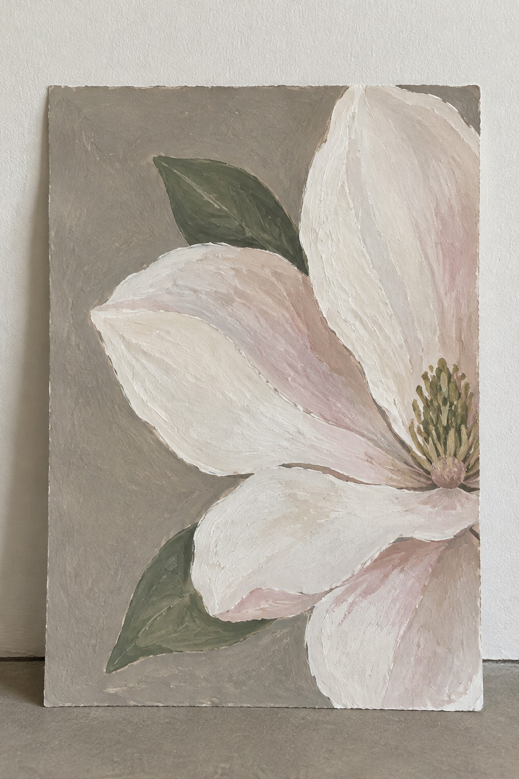 Textured painting of large white magnolia with pink tones, green leaves on gray.