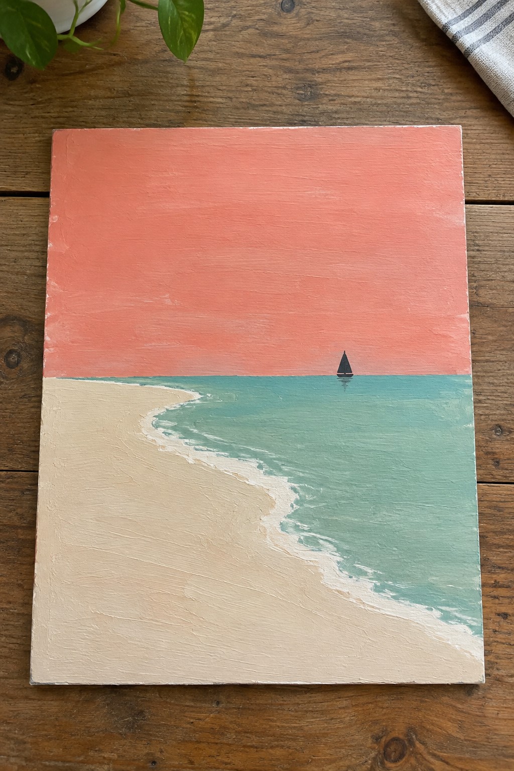 Minimalist beach painting with coral sky, turquoise sea, sandy shore, and lone sailboat.
