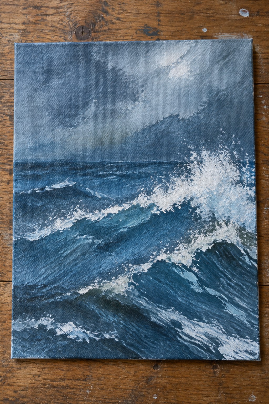 Stormy seascape painting of dark blue crashing waves with white foam on wood