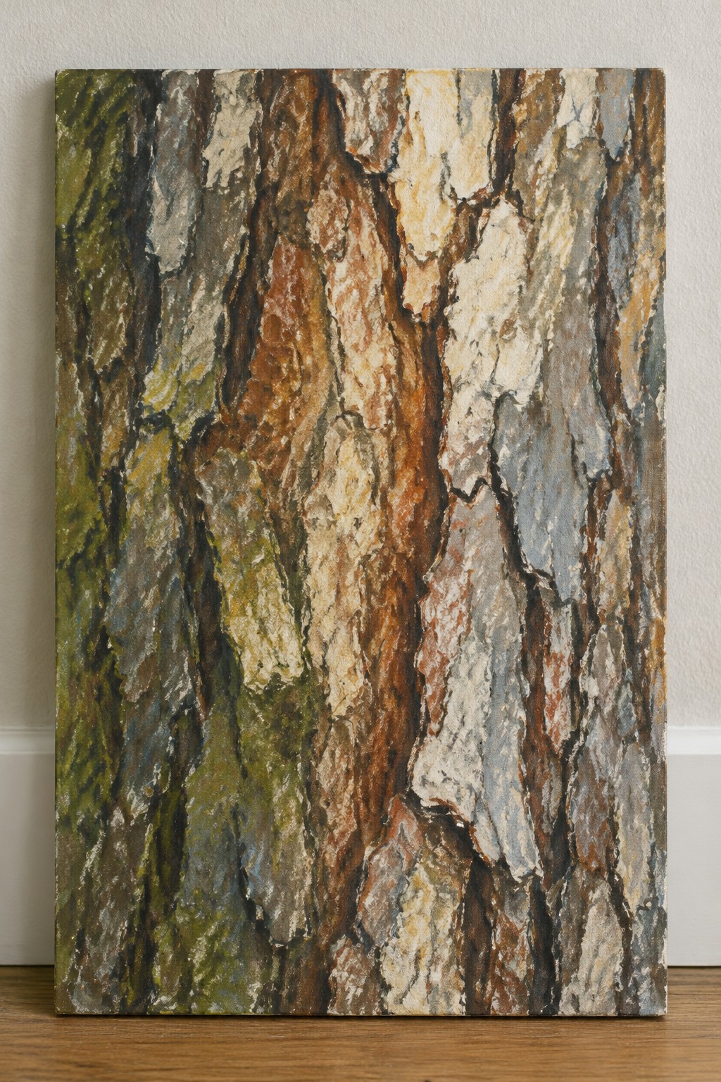 Thickly textured painting of multicolored tree bark leaning against white wall on wood floor