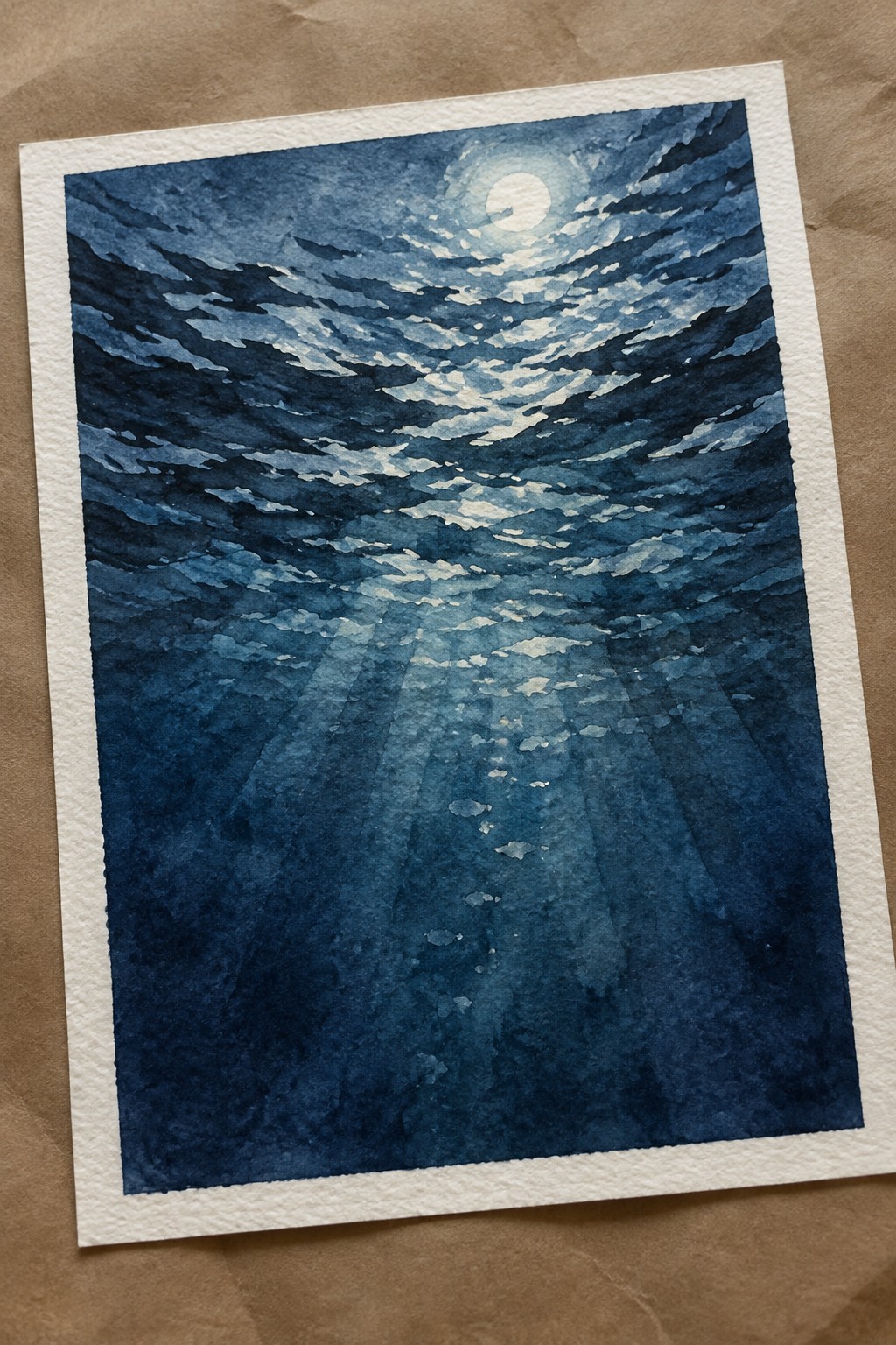 Blue watercolor underwater scene with moon, light rays, and fish silhouettes