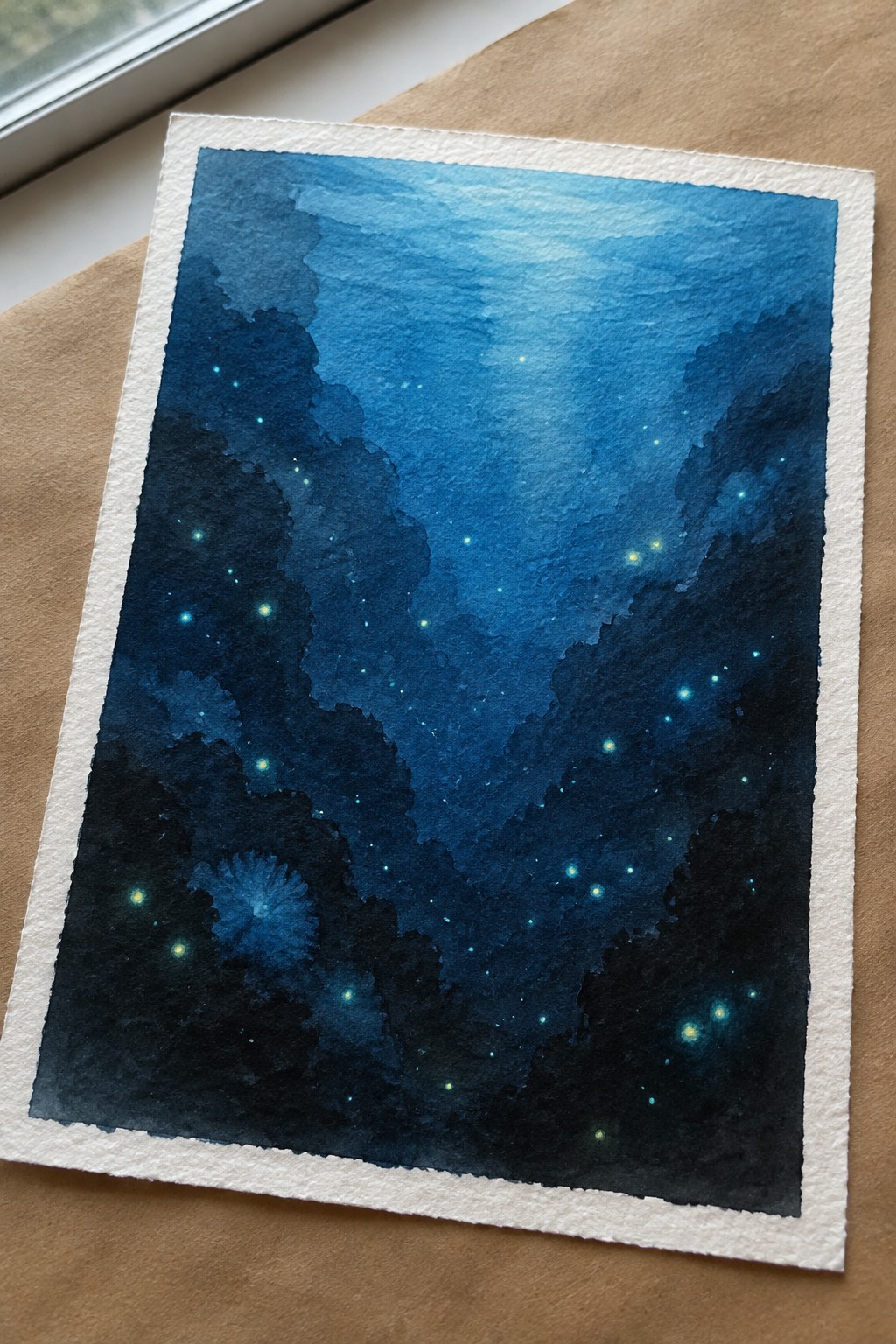 Watercolor painting of deep blue starry sky with dark clouds and glowing blue flower