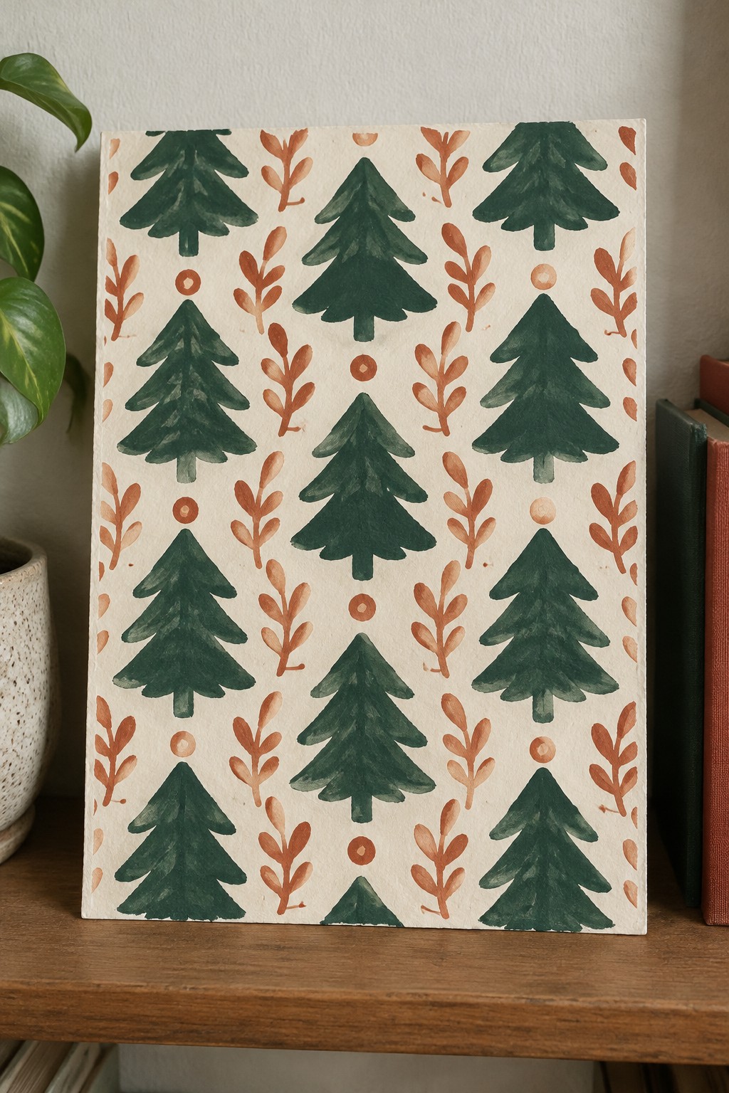 A painting of repeating green evergreen trees and reddish-brown branch motifs arranged in a grid on a light background.