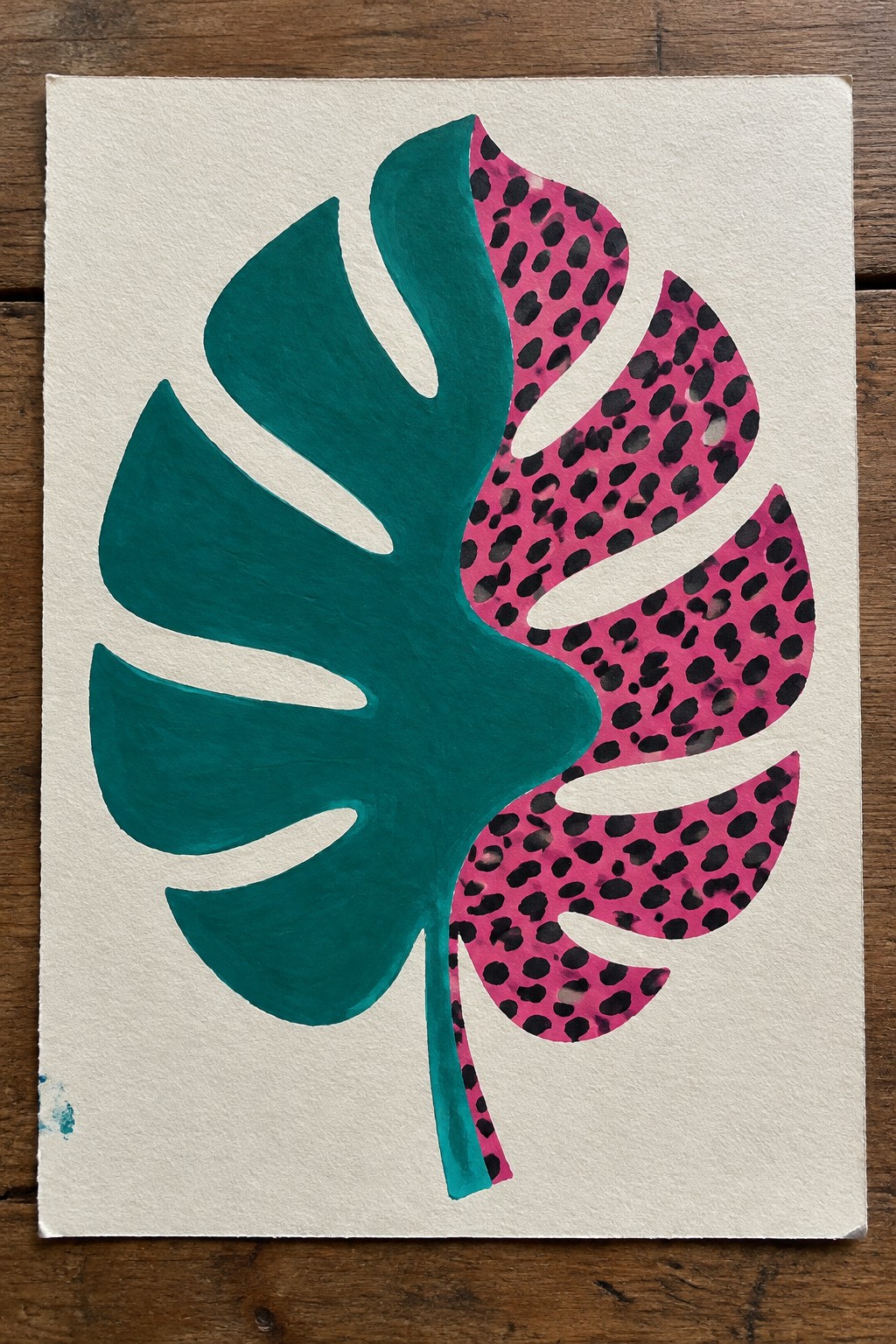Monstera leaf painting half solid teal and half pink with black spots