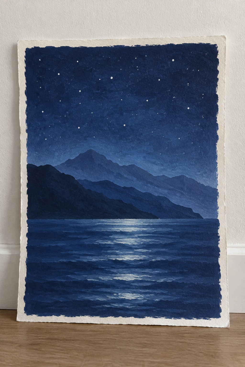 Watercolor night landscape of starry sky over layered mountains reflected in rippling blue water.