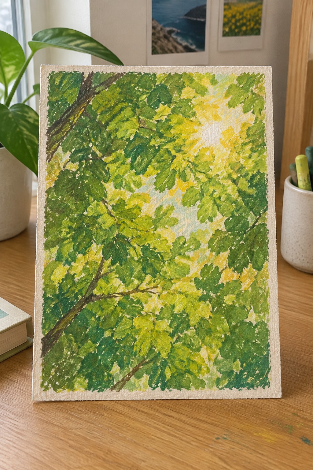 Watercolor painting of lush green leaves with sunlight filtering through branches