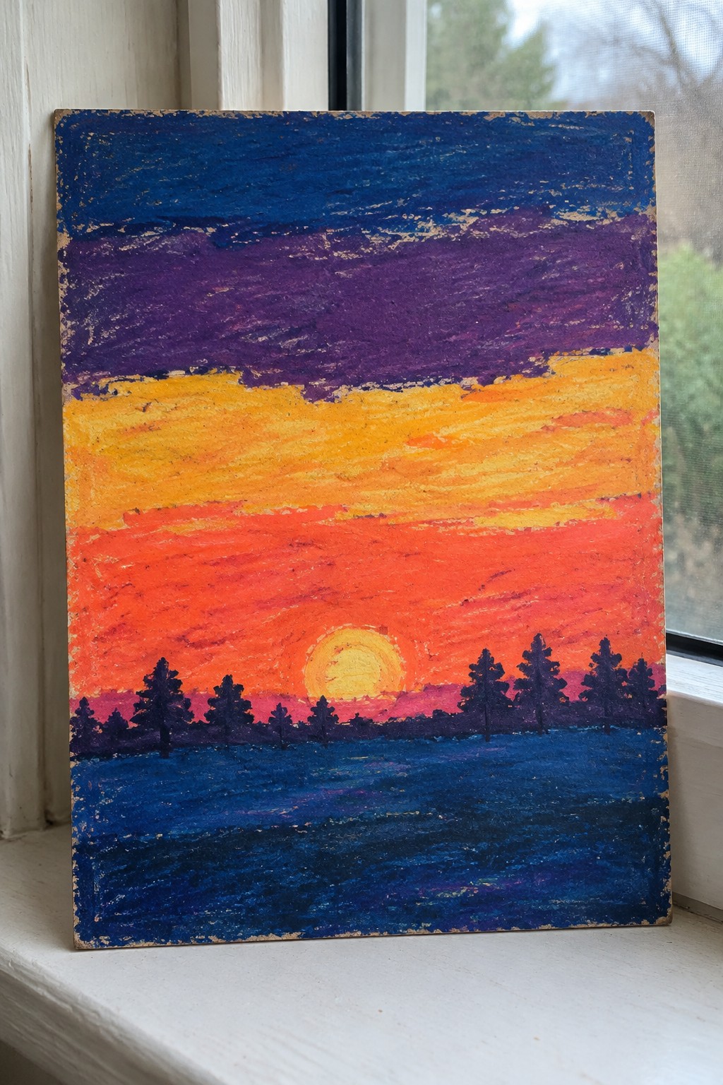 Vibrant sunset painting with orange-red sky, yellow sun, silhouetted pines above blue water