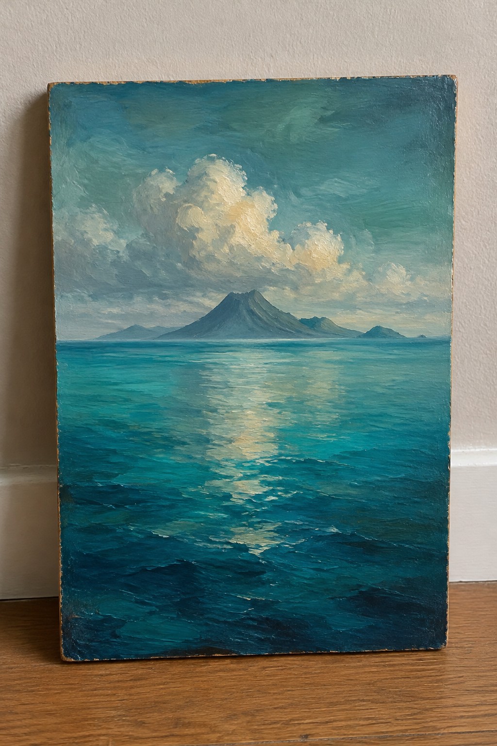Choppy turquoise ocean waves with sunlight reflection, distant mountain under dramatic clouds.