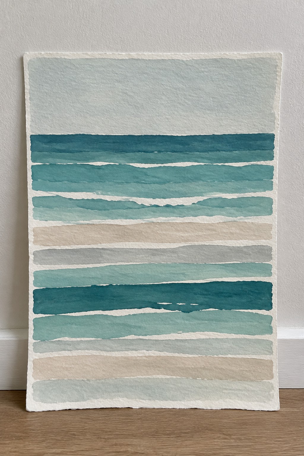 Abstract watercolor with horizontal stripes in teal, blue, beige and gray tones on textured paper