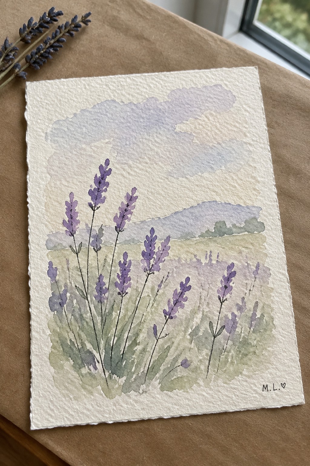 Watercolor painting of purple lavender stalks in a soft hilly field on textured paper.
