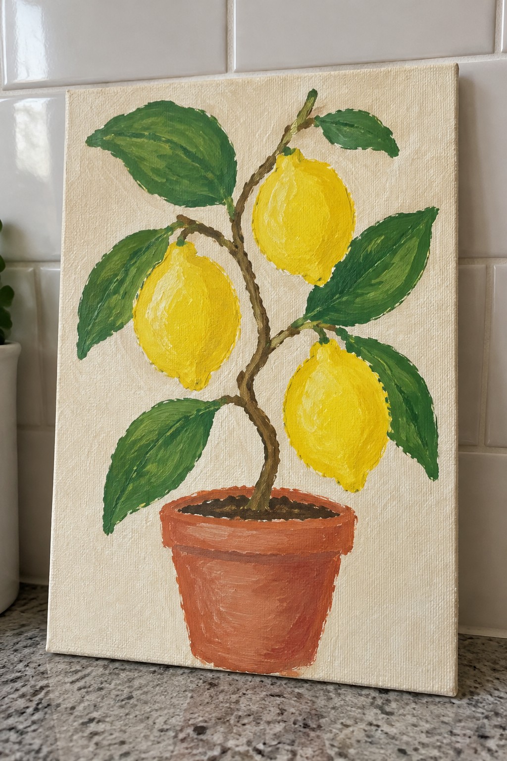Canvas painting of lemon tree with yellow fruit in terracotta pot