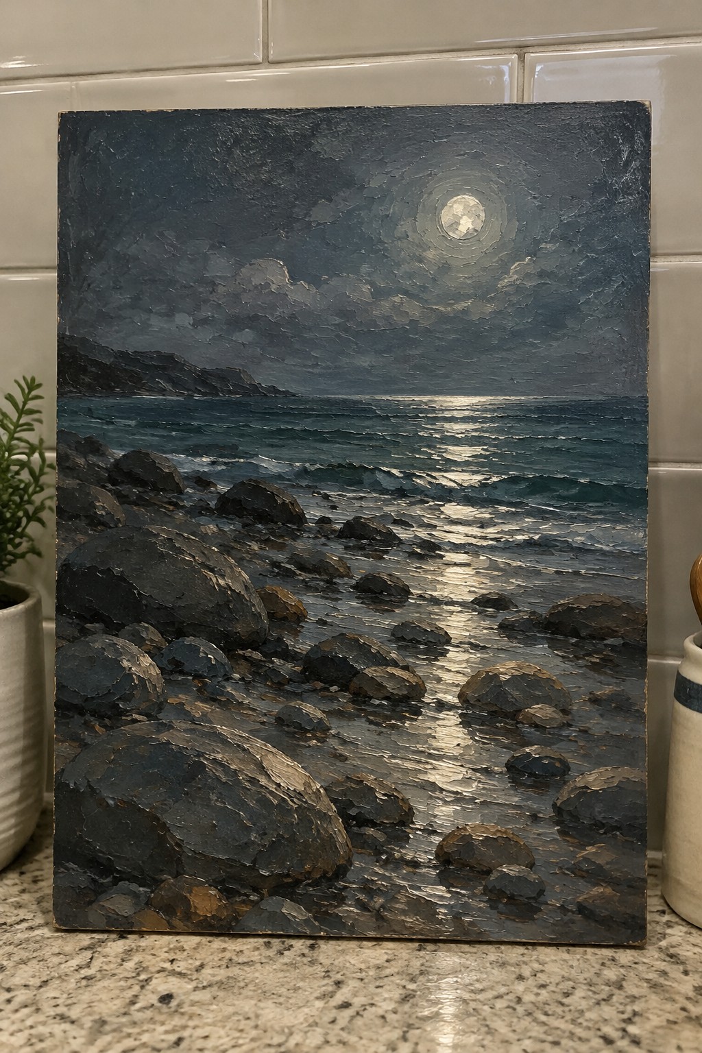 Textured oil painting of full moon glowing over rocky shoreline with crashing waves at night.