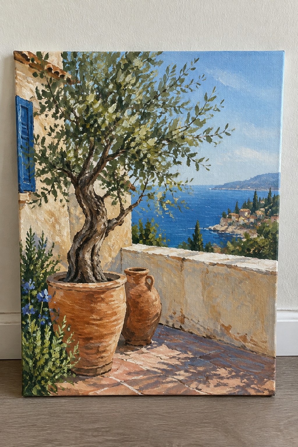 Mediterranean balcony with potted olive tree, clay pots, sea view and blue sky
