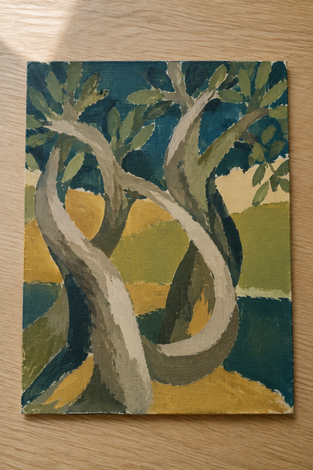 Abstract painting of twisting gray tree trunks amid yellow and green hills.