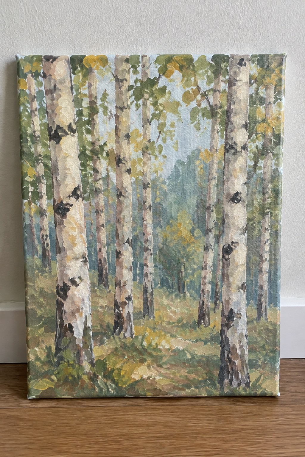 Painting of white birch trees with black markings along a sunlit forest path