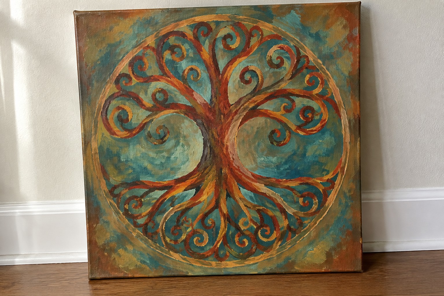 Circular tree of life painting with swirling brown roots, golden leaves, and teal background