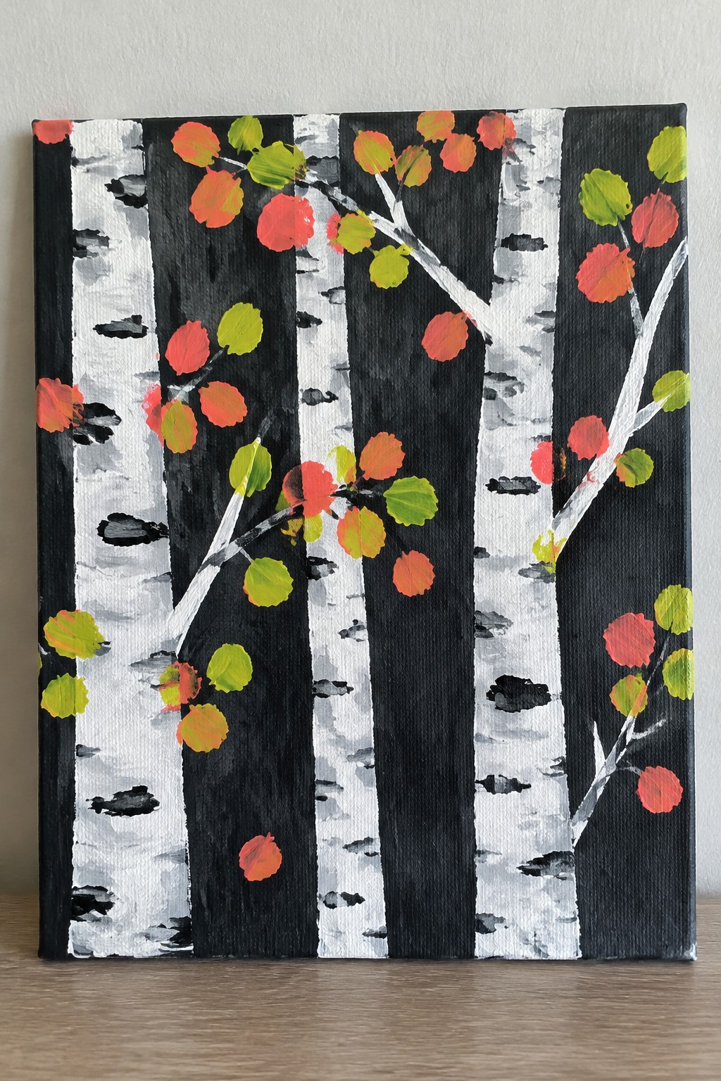 Autumn birch trees with white bark and red orange green leaves on canvas.