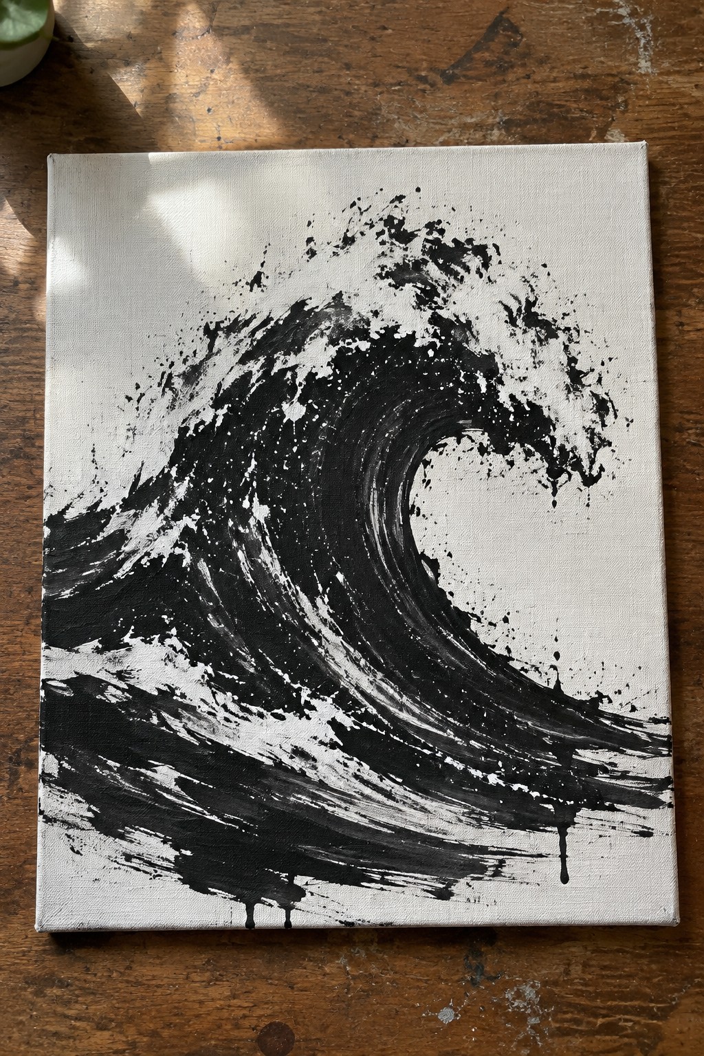 Abstract black and white wave painting with splatters and drips on canvas
