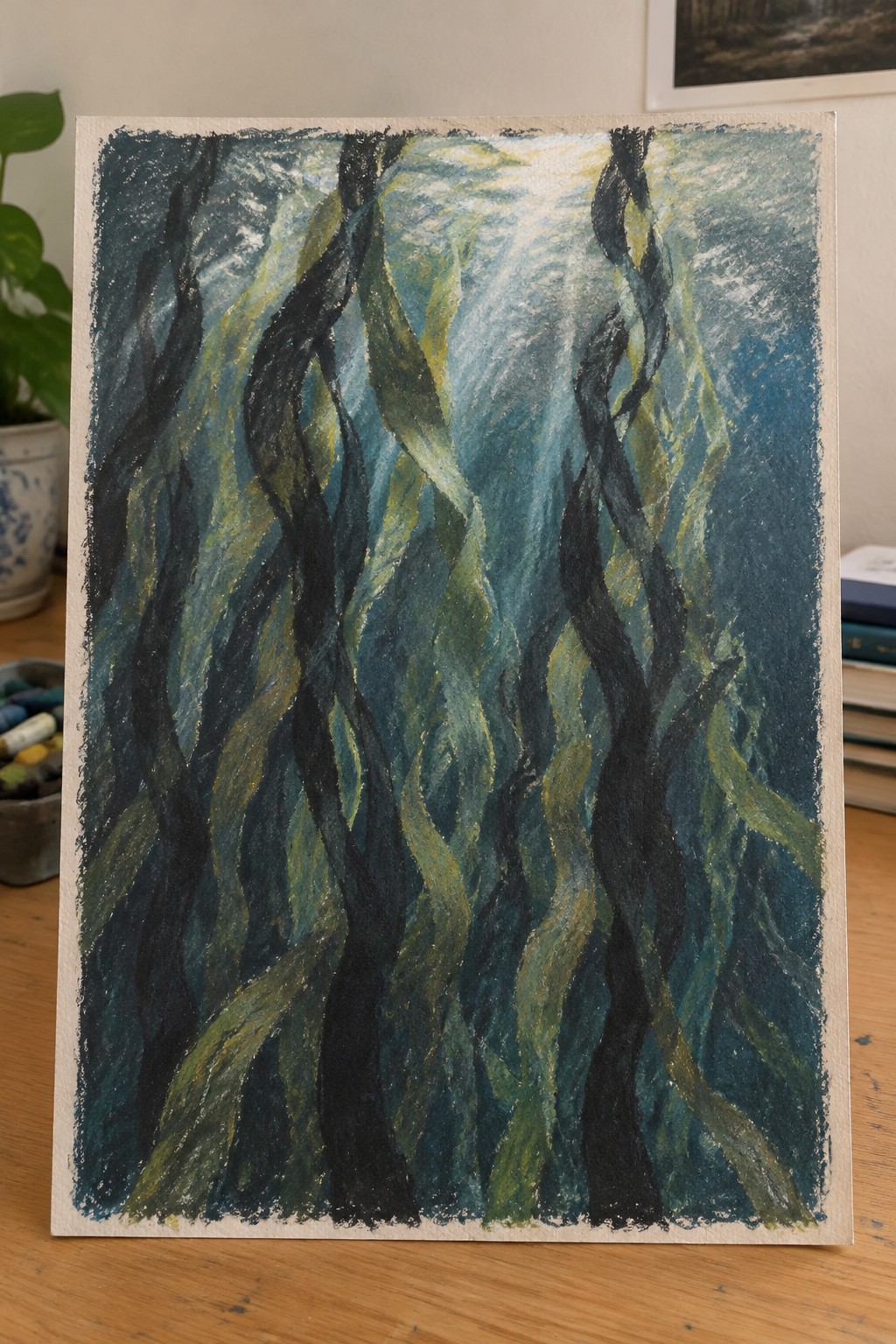 Twisting dark green kelp fronds rising through sunlit blue ocean water