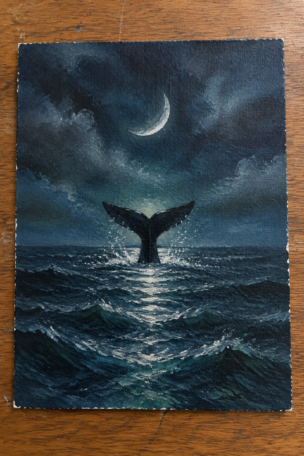 A painting of a dark whale tail splashing in choppy ocean waves under a crescent moon in a cloudy night sky.
