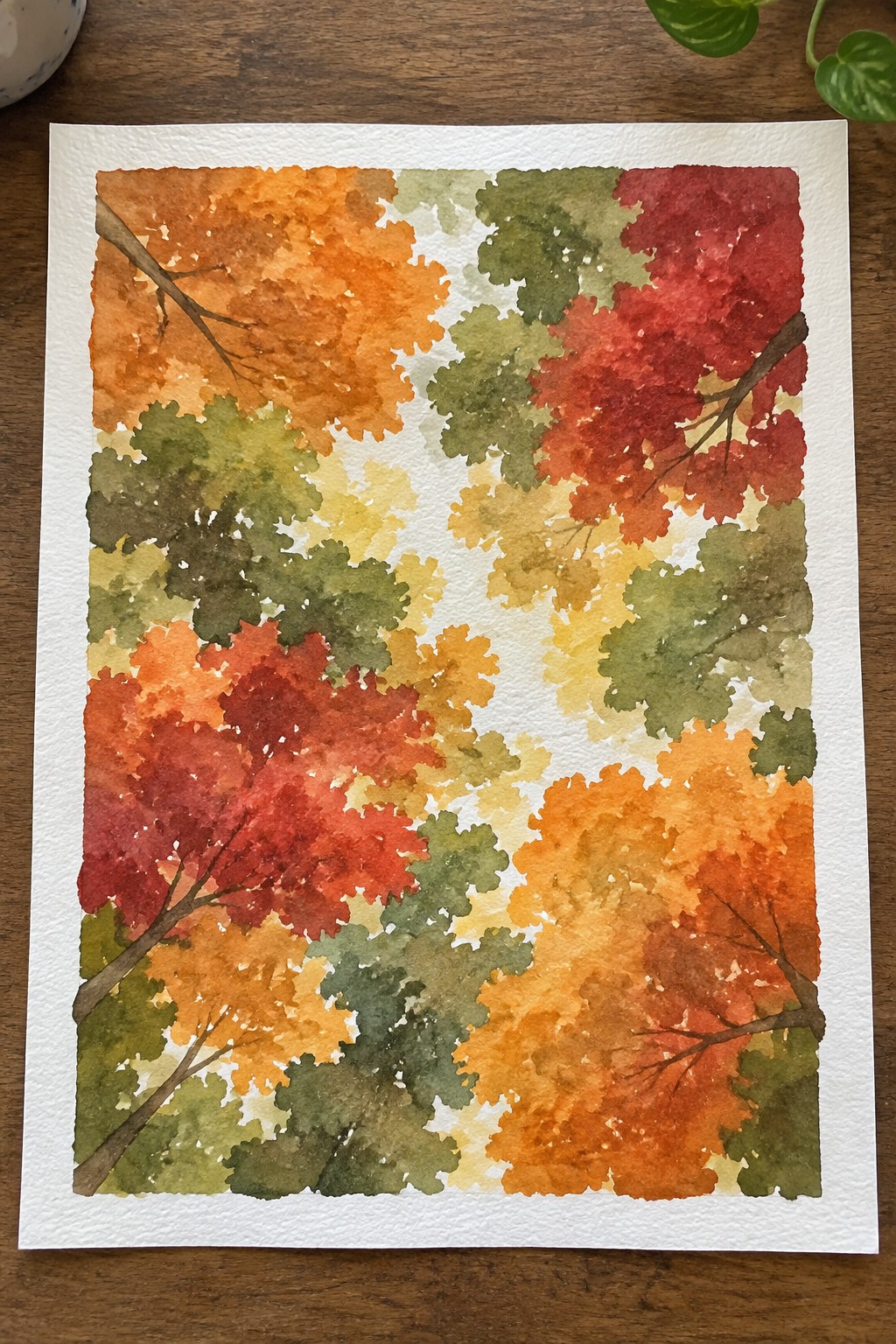 Watercolor painting of autumn trees with red, orange, yellow, and green foliage on white paper.