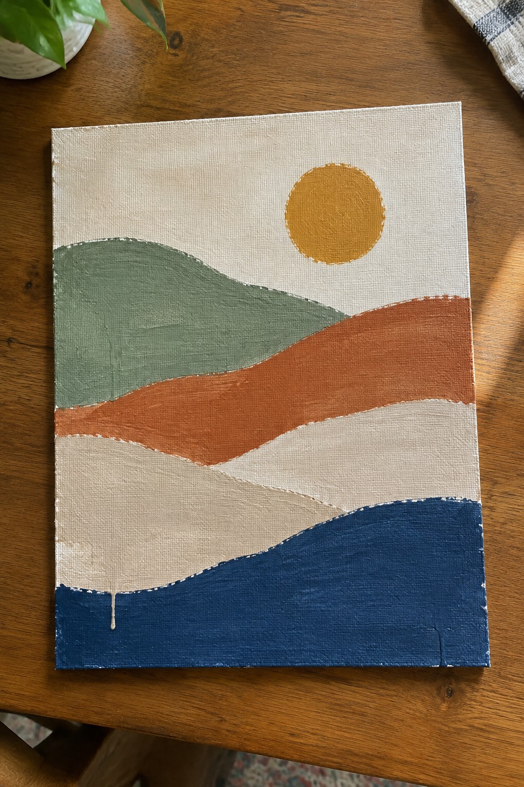 Abstract painting on canvas with wavy green, orange, beige, blue layers and yellow sun