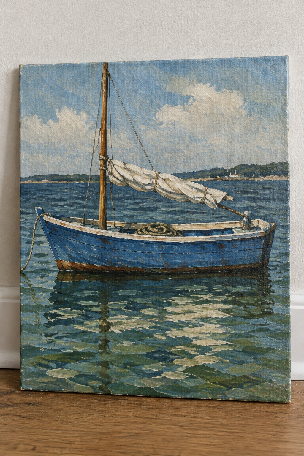 A painting of a blue wooden boat with a white sail floating on blue water, showing reflections and a distant green shoreline.