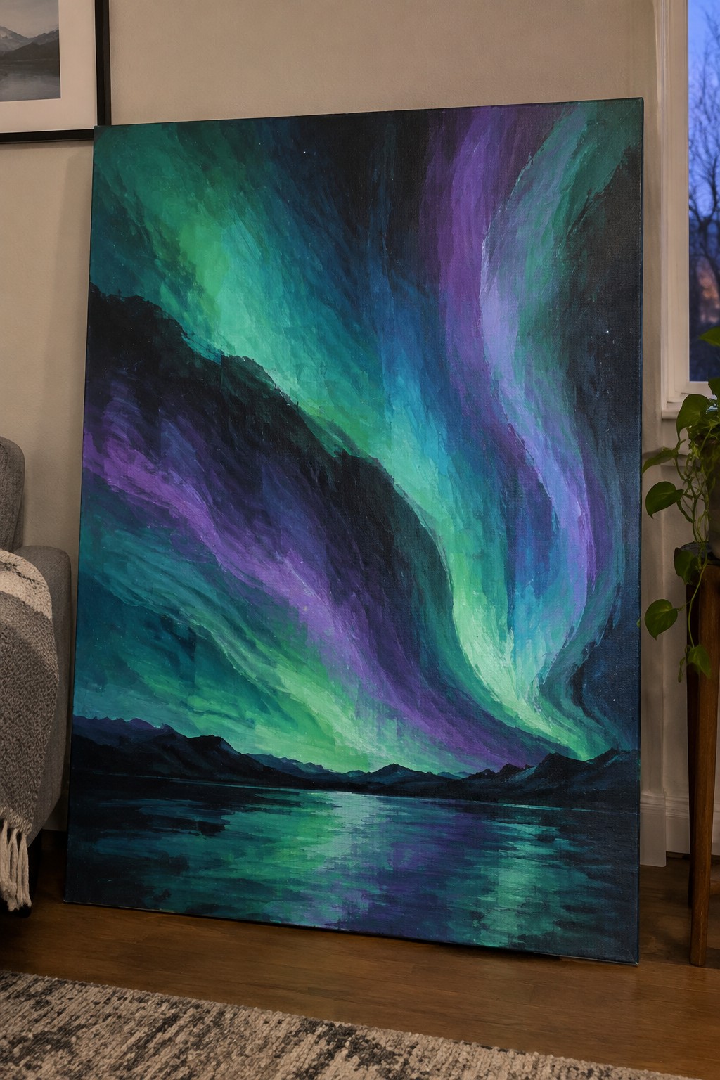 Vivid green and purple aurora borealis painting leaning against living room wall