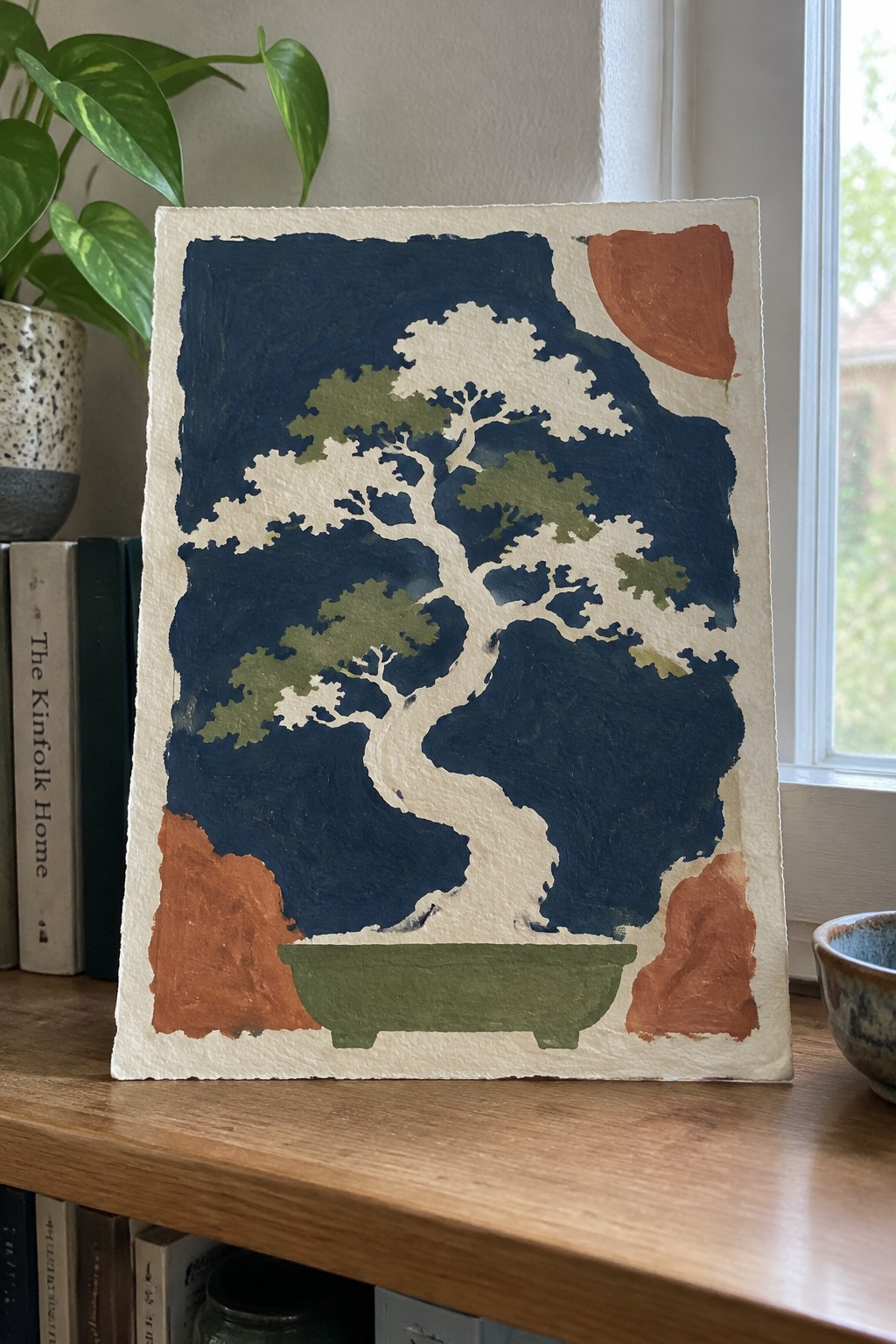 Stylized bonsai tree with white trunk and green foliage on deep blue background with orange accents