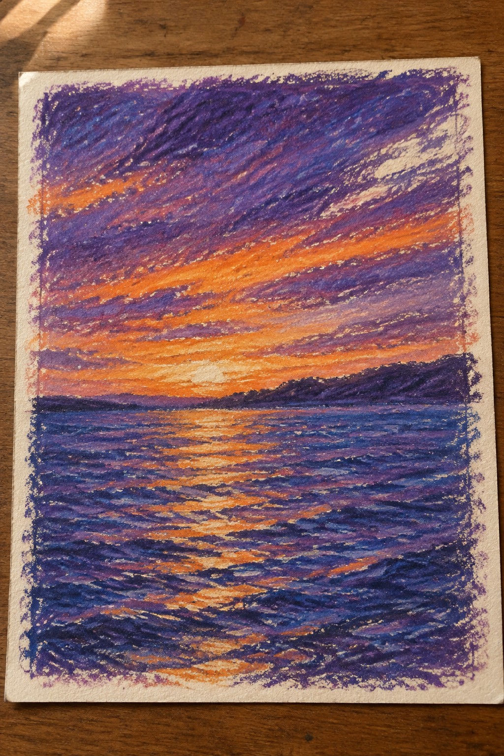 Vibrant pastel sunset over ocean with orange-purple sky reflecting on wavy water and distant hills
