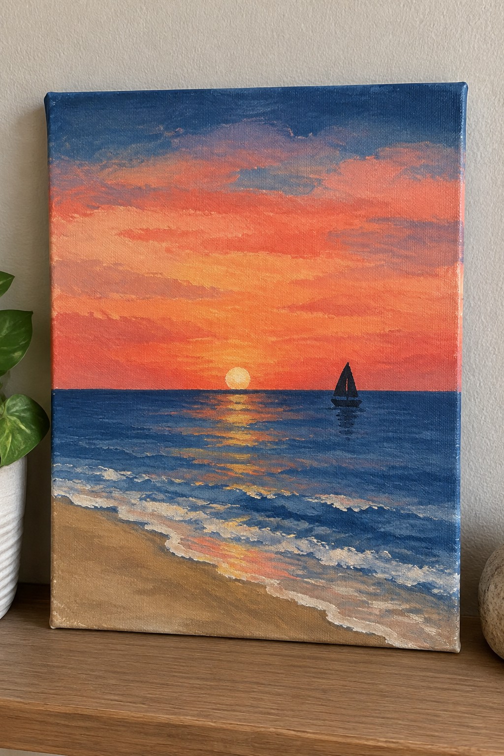 Vibrant sunset painting with orange sky, sailboat on blue ocean, waves on beach