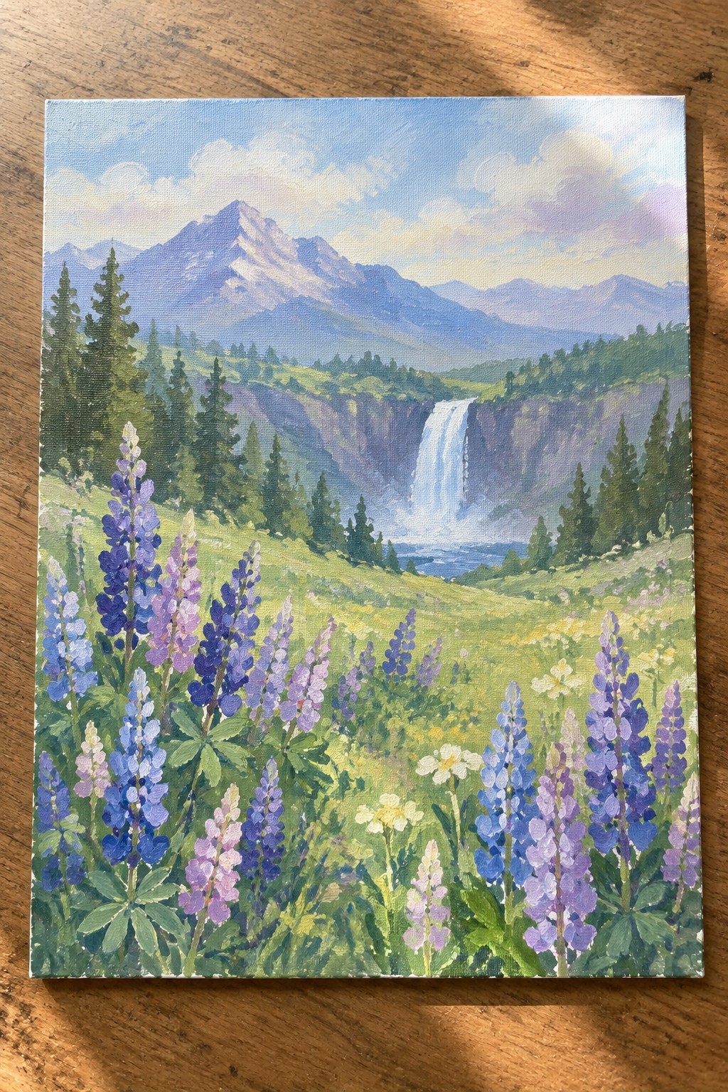 Painting of purple lupines overlooking a cascading waterfall and snow-capped mountains.
