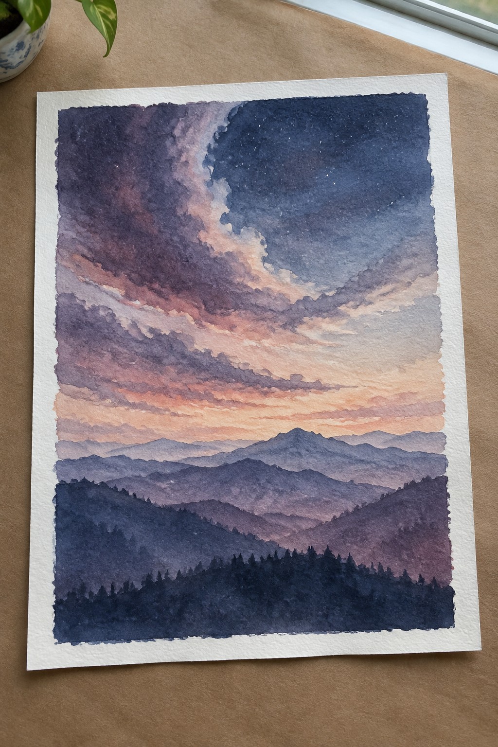 Watercolor of layered purple mountains under pink-orange clouds with stars and forest silhouette