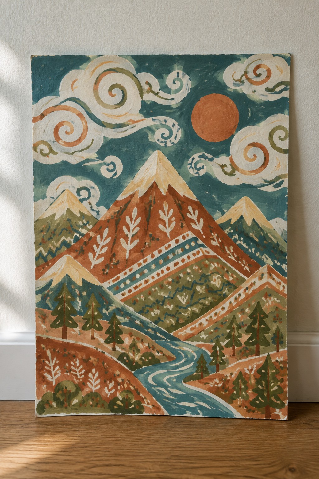 Stylized mountain landscape with patterned peaks, winding river, pines, and swirling clouds