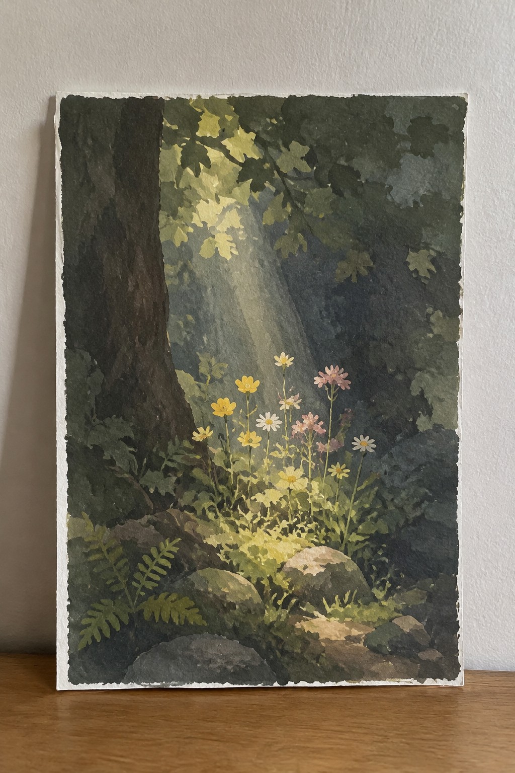 Watercolor forest scene with sunlight rays on wildflowers, rocks, and tree trunk